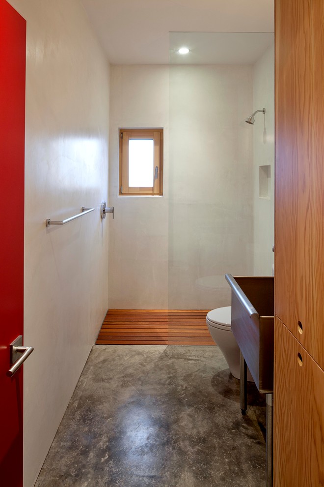 Contemporary bathroom in Portland with beige walls, concrete floors and a curbless shower.