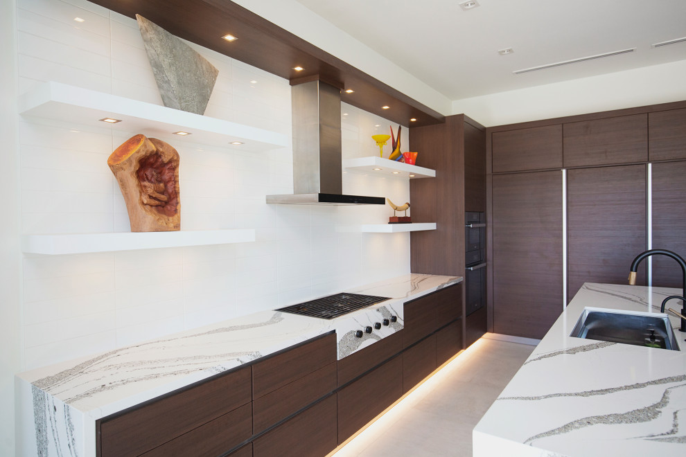 Photo of a large modern l-shaped eat-in kitchen in Miami with a drop-in sink, flat-panel cabinets, brown cabinets, quartzite benchtops, white splashback, ceramic splashback, coloured appliances, marble floors, with island, white floor and white benchtop.