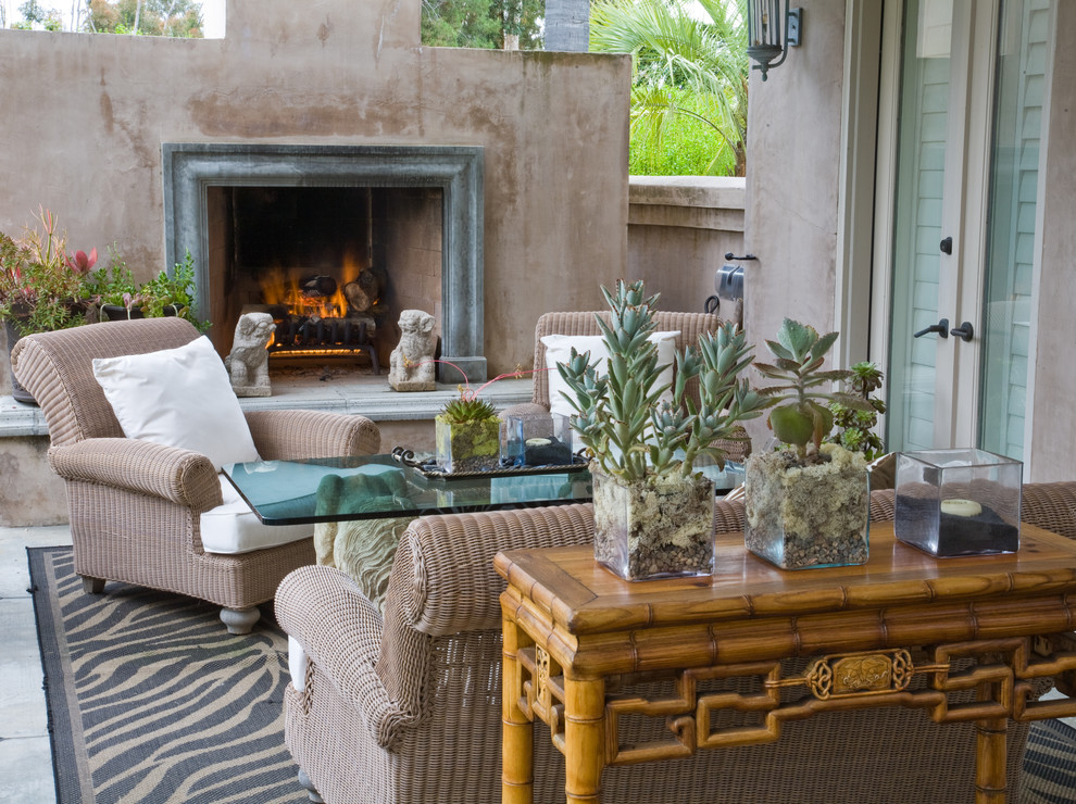 Mid-sized mediterranean courtyard patio in San Diego with a fire feature, concrete slab and a pergola.