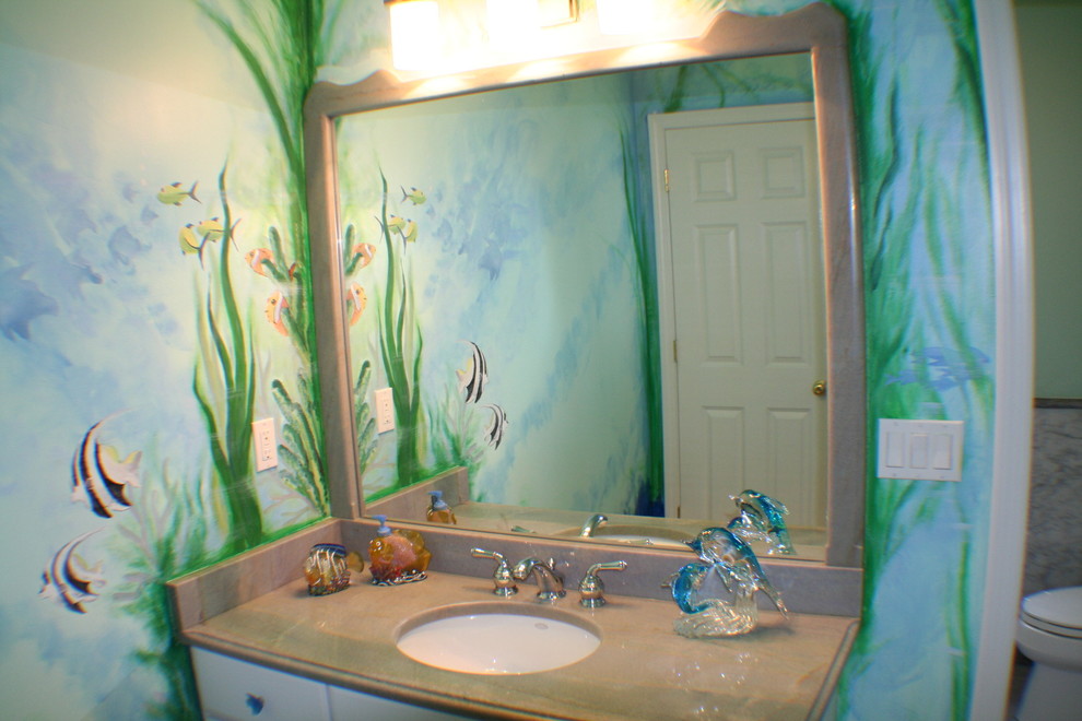 Inspiration for a small beach style kids bathroom in Miami with an undermount sink, raised-panel cabinets, white cabinets and a one-piece toilet.