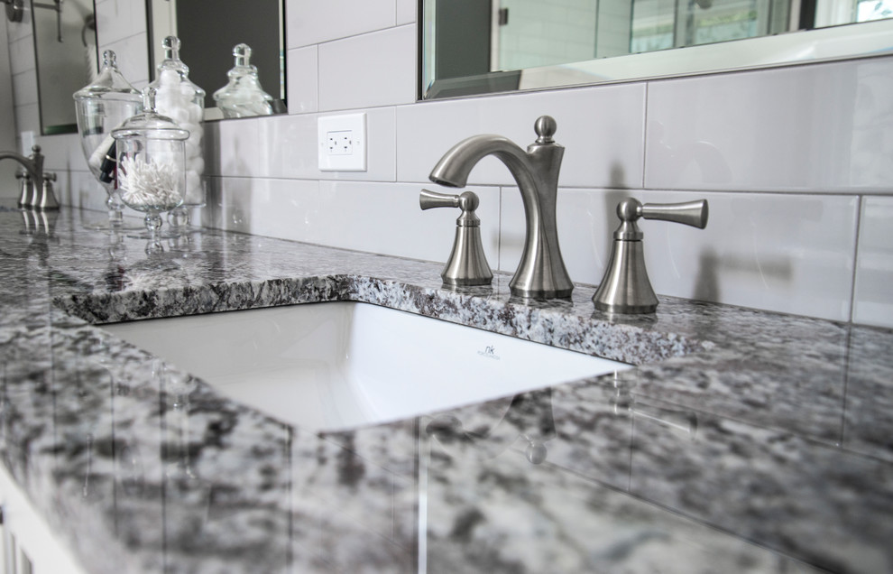 Mid-sized transitional master gray tile and subway tile porcelain tile freestanding bathtub photo in Chicago with flat-panel cabinets, white cabinets, a two-piece toilet, gray walls, an undermount sink and granite countertops