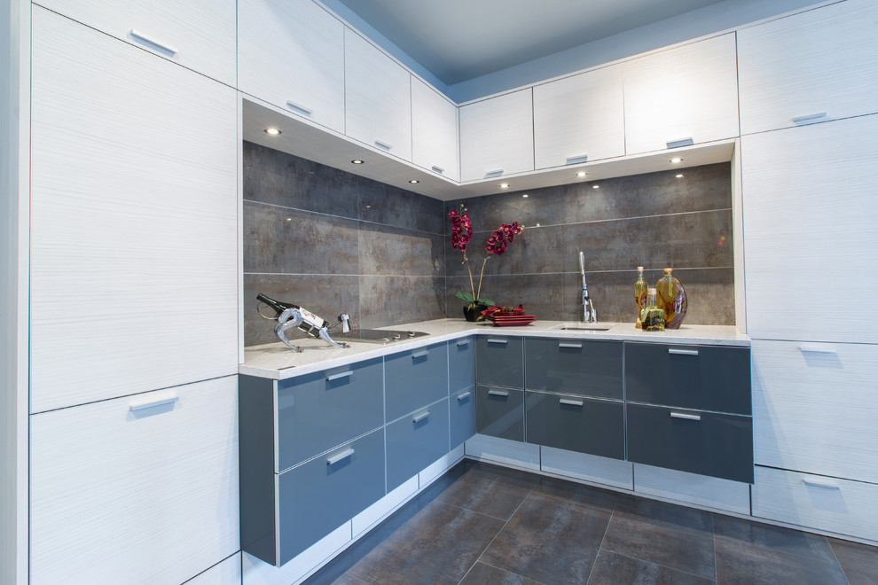 Mid-sized contemporary l-shaped eat-in kitchen in New York with an undermount sink, flat-panel cabinets, white cabinets, brown splashback, stainless steel appliances and ceramic floors.