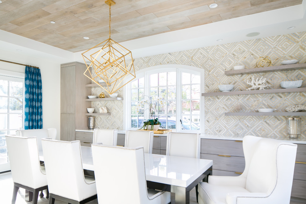 Inspiration for a beach style dining room in Orange County with beige walls.