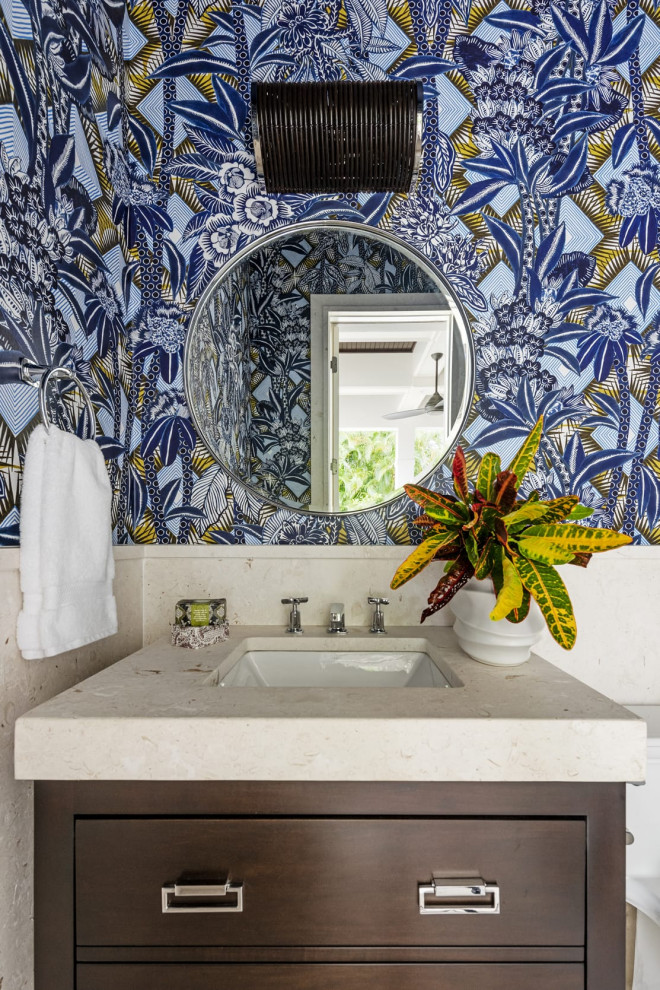 Design ideas for a tropical powder room in Other.