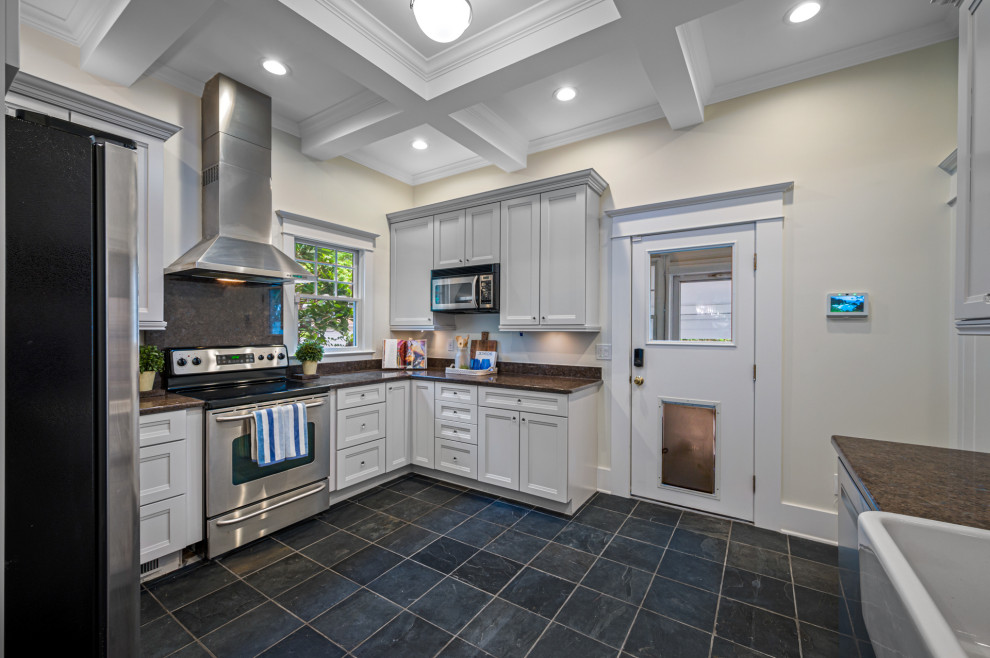 Design ideas for a mid-sized contemporary l-shaped separate kitchen in Tampa with an undermount sink, shaker cabinets, beige cabinets, stainless steel appliances, marble floors and with island.