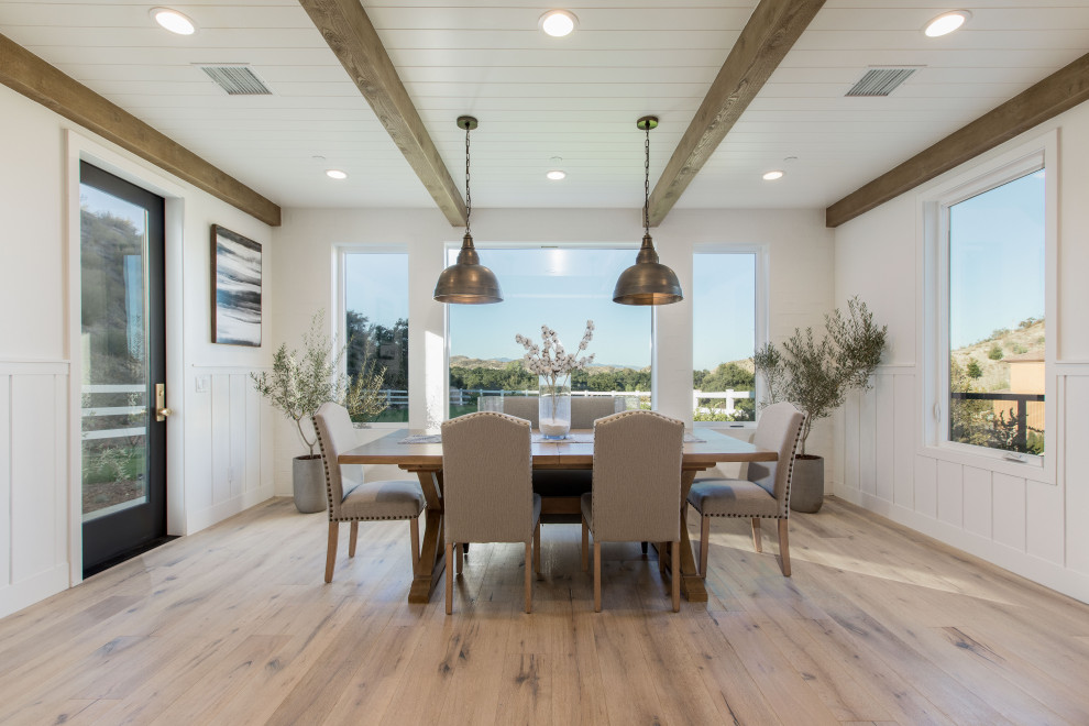 Photo of a country dining room in Orange County.