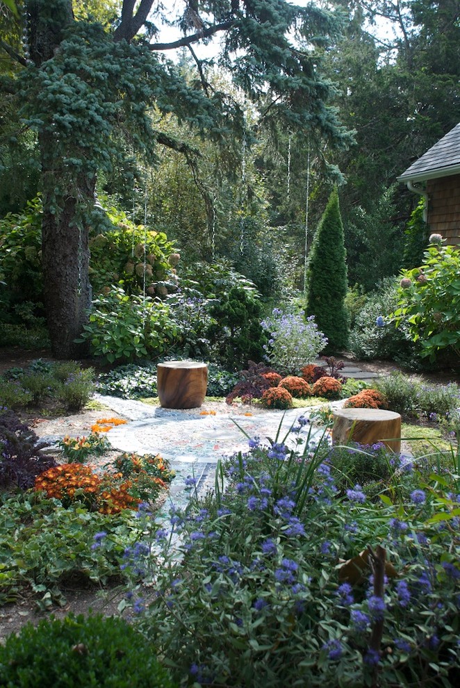 Photo of an eclectic backyard shaded garden in New York with a garden path.