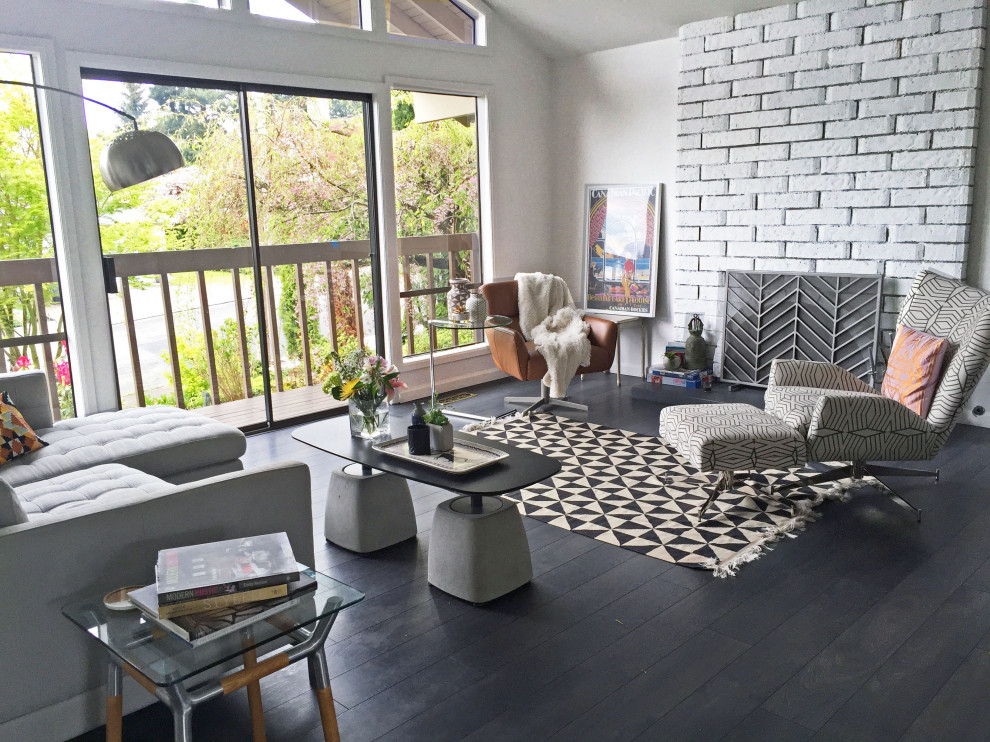 Inspiration for a mid-sized contemporary open concept dark wood floor and black floor living room remodel with white walls, a wood stove, a brick fireplace and no tv