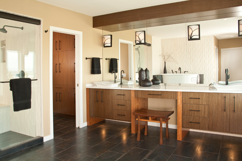 This is an example of a large asian master bathroom in Seattle with a vessel sink, flat-panel cabinets, dark wood cabinets, engineered quartz benchtops, white tile, porcelain tile, beige walls and porcelain floors.