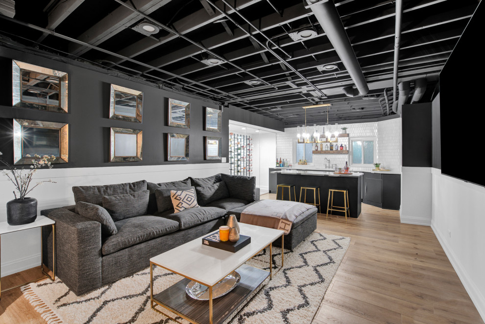 Example of a large trendy living room design in Chicago with black walls