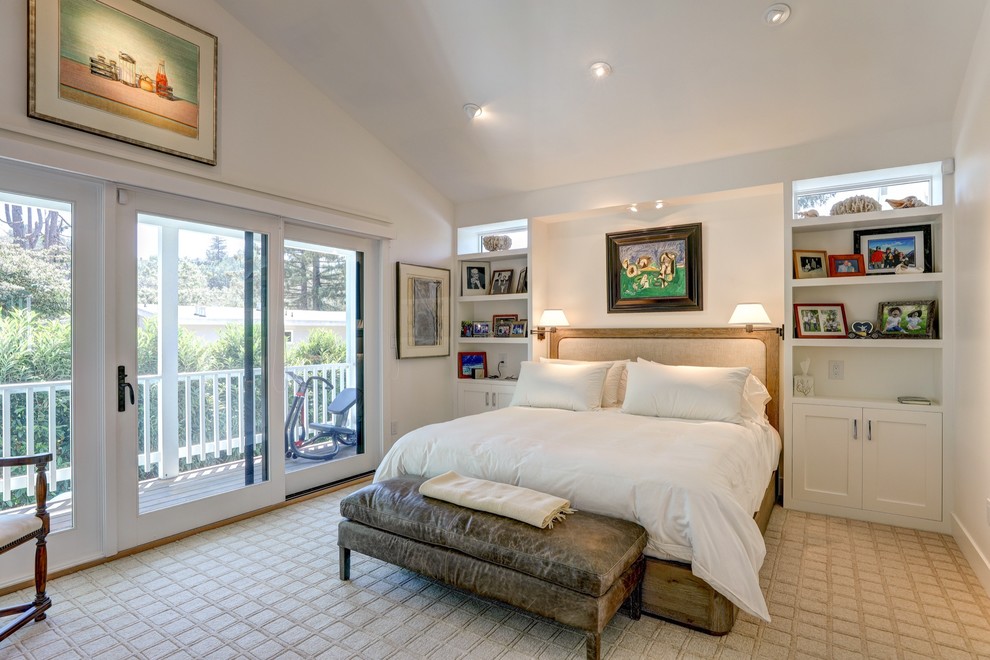 This is an example of a country master bedroom in San Francisco with white walls, carpet and beige floor.