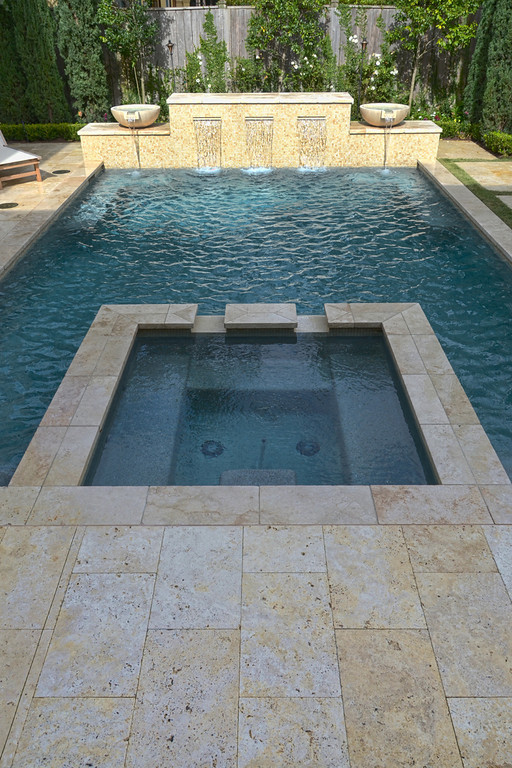 Inspiration for a mid-sized transitional backyard rectangular and tile pool fountain remodel in Houston