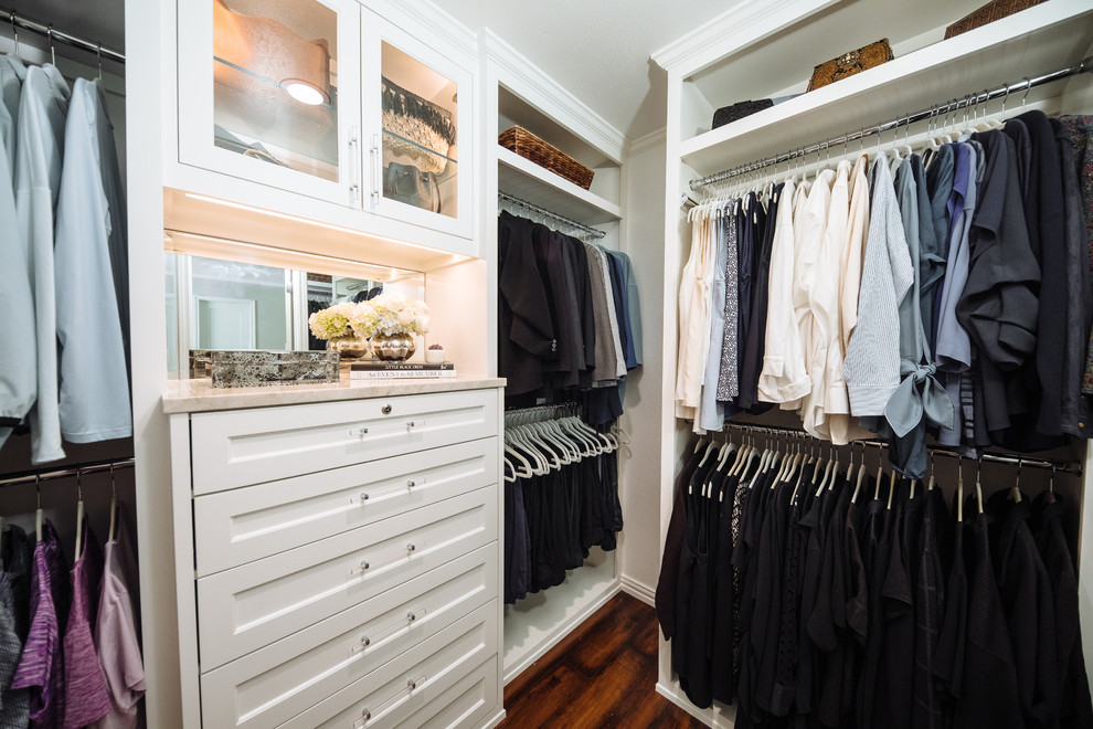 Photo of a small transitional women's walk-in wardrobe in Dallas with beaded inset cabinets, white cabinets, dark hardwood floors and brown floor.