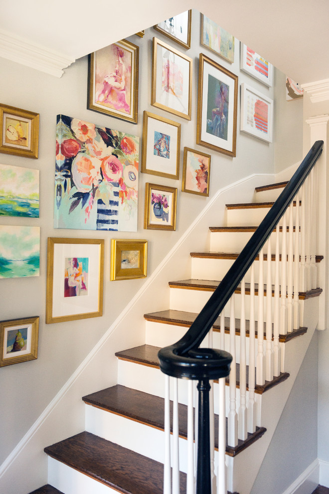 Photo of a mid-sized transitional wood l-shaped staircase in Boston with painted wood risers and wood railing.