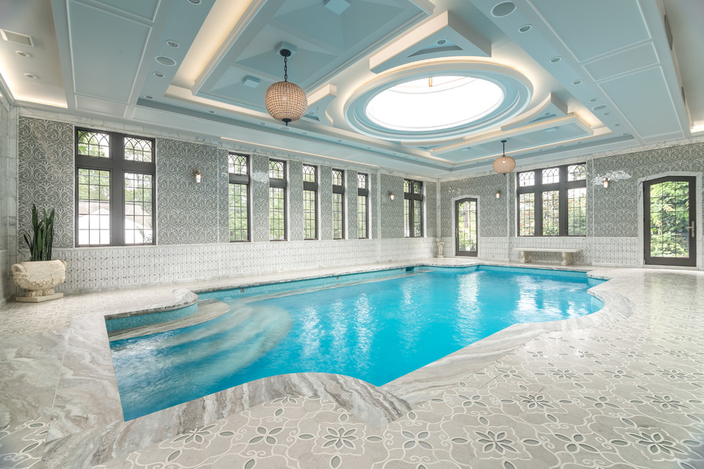 Inspiration for a traditional indoor custom-shaped pool in New York with tile.