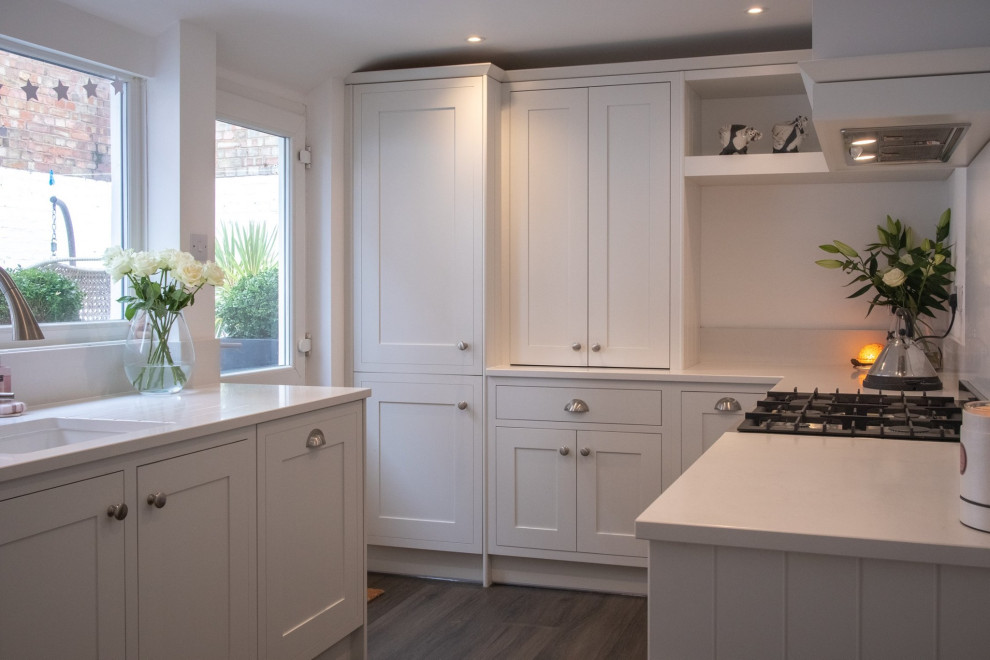 Photo of a small contemporary eat-in kitchen in Other with an integrated sink, shaker cabinets, white cabinets, stone slab splashback and no island.