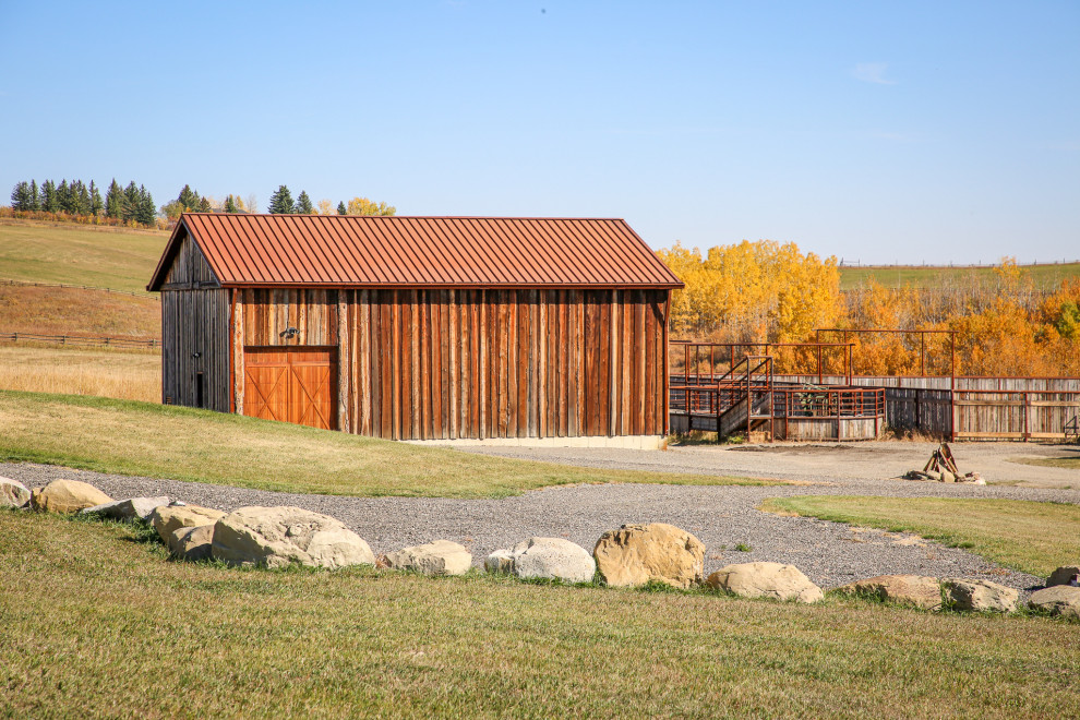 Example of a mountain style home design design in Calgary