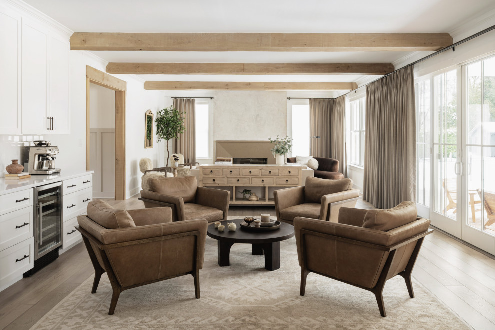 Example of a mid-sized transitional light wood floor, beige floor, exposed beam and wall paneling living room design in Philadelphia with white walls, a standard fireplace and a concrete fireplace