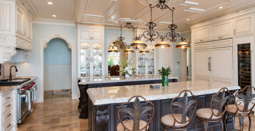 Photo of a large u-shaped kitchen/diner in New York with an integrated sink, shaker cabinets, beige cabinets, engineered stone countertops, beige splashback, engineered quartz splashback, stainless steel appliances, multiple islands, brown floors, beige worktops and a coffered ceiling.