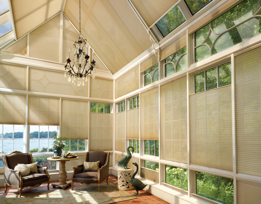 Large traditional sunroom in Orange County with ceramic floors, no fireplace and a skylight.