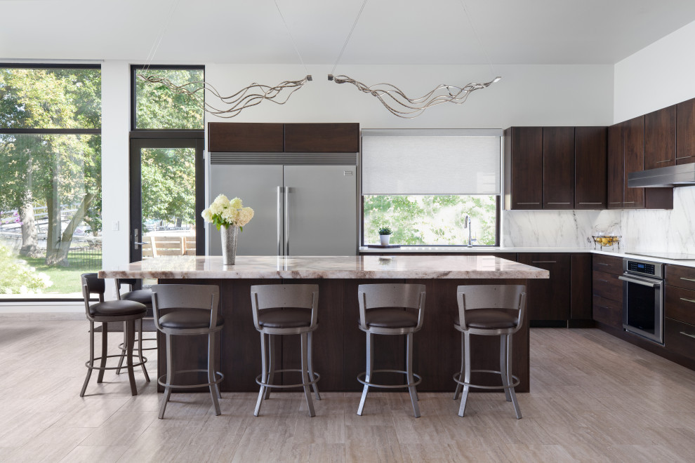 Inspiration for a contemporary l-shaped kitchen in Other with an undermount sink, flat-panel cabinets, dark wood cabinets, grey splashback, stainless steel appliances, medium hardwood floors, with island and brown floor.