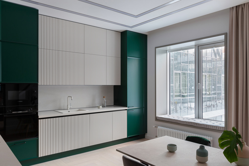 Eat-in kitchen - mid-sized contemporary single-wall eat-in kitchen idea in Novosibirsk with an undermount sink, beaded inset cabinets, green cabinets, quartz countertops, white backsplash, black appliances, no island and white countertops
