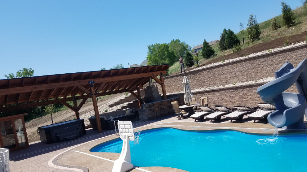 Large 1960s backyard concrete paver pool landscaping photo