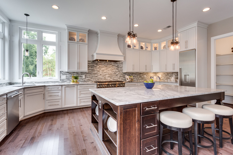 Large transitional u-shaped dark wood floor open concept kitchen photo in DC Metro with an undermount sink, shaker cabinets, white cabinets, granite countertops, glass tile backsplash and an island