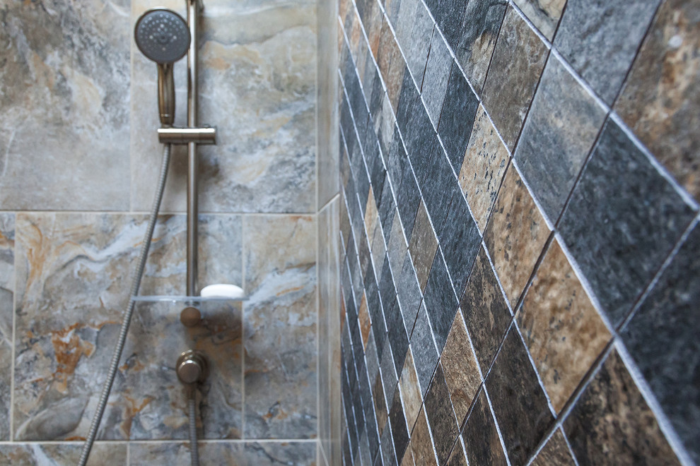 Example of a mid-sized transitional master gray tile and porcelain tile porcelain tile and brown floor home design design in Phoenix with shaker cabinets, dark wood cabinets, a one-piece toilet, beige walls, an undermount sink, granite countertops and beige countertops