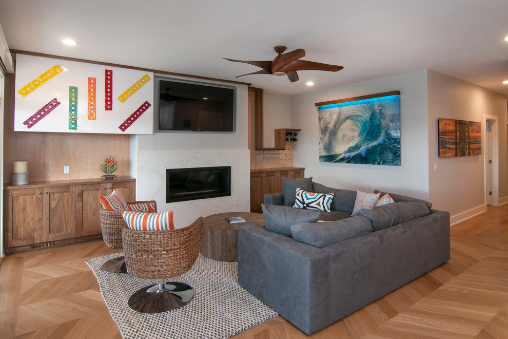 Photo of a large contemporary open concept living room in Other with grey walls, light hardwood floors, a ribbon fireplace, a concrete fireplace surround and a wall-mounted tv.