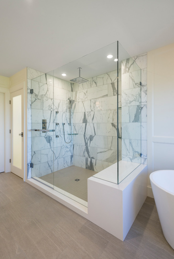 Design ideas for a large traditional master bathroom in Vancouver with shaker cabinets, white cabinets, a freestanding tub, an alcove shower, a one-piece toilet, white tile, stone tile, white walls, porcelain floors, an undermount sink, engineered quartz benchtops, grey floor and a hinged shower door.