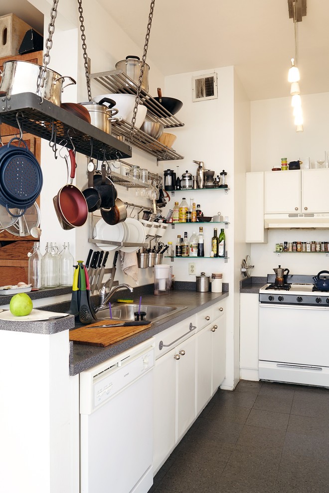 Transitional kitchen photo in New York with a drop-in sink, open cabinets, white cabinets, white backsplash, white appliances and no island