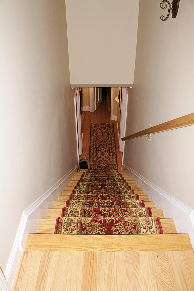 Hallway - mid-sized traditional medium tone wood floor hallway idea with green walls