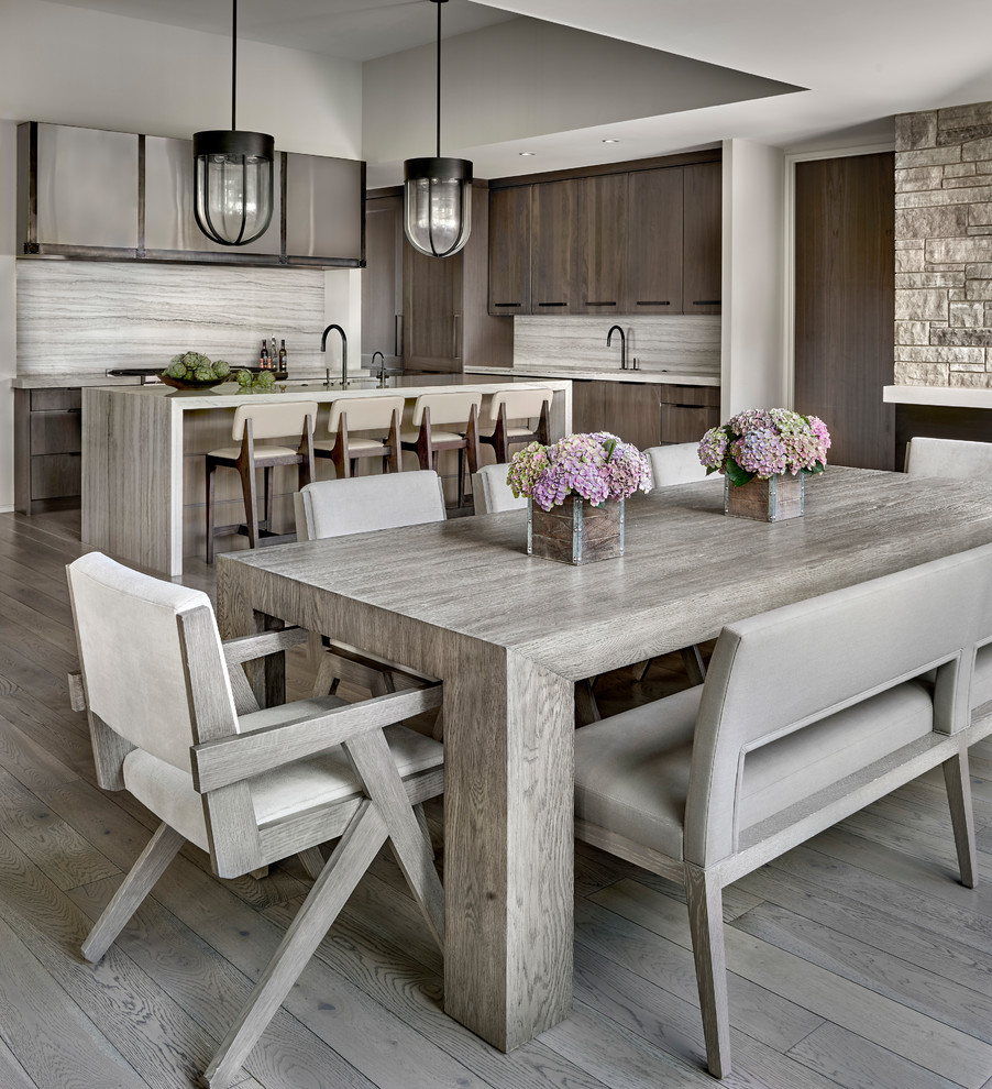 Contemporary dining room in Chicago with medium hardwood floors and grey floor.