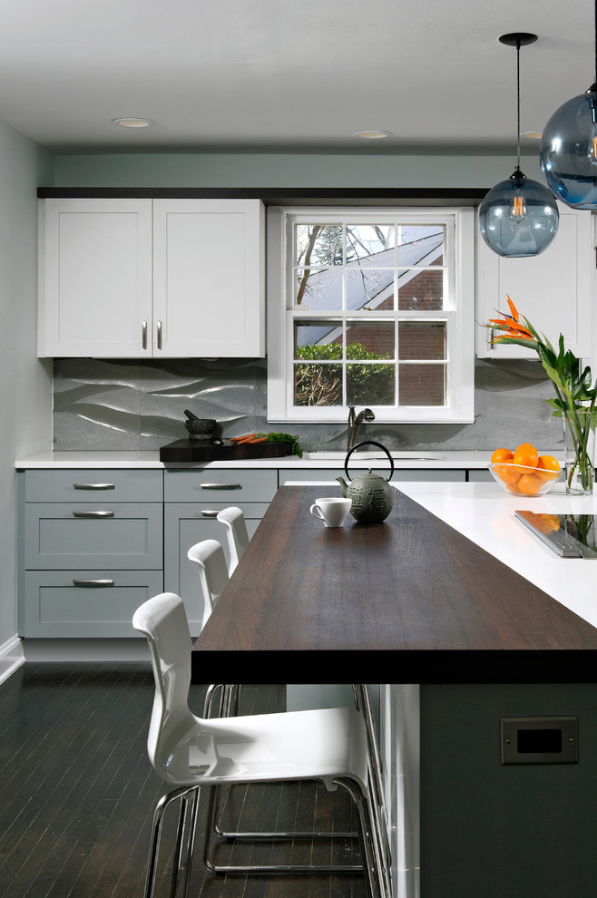 Inspiration for a mid-sized contemporary u-shaped eat-in kitchen in DC Metro with an undermount sink, shaker cabinets, dark hardwood floors, with island, grey cabinets, grey splashback, stainless steel appliances, quartzite benchtops, cement tile splashback and brown floor.