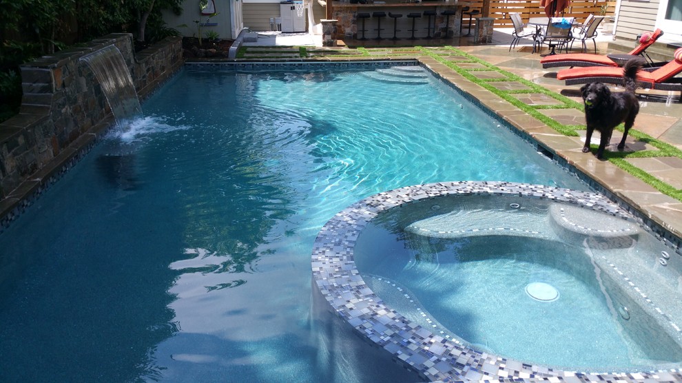 Example of a mid-sized transitional backyard stone and rectangular lap pool fountain design in San Francisco