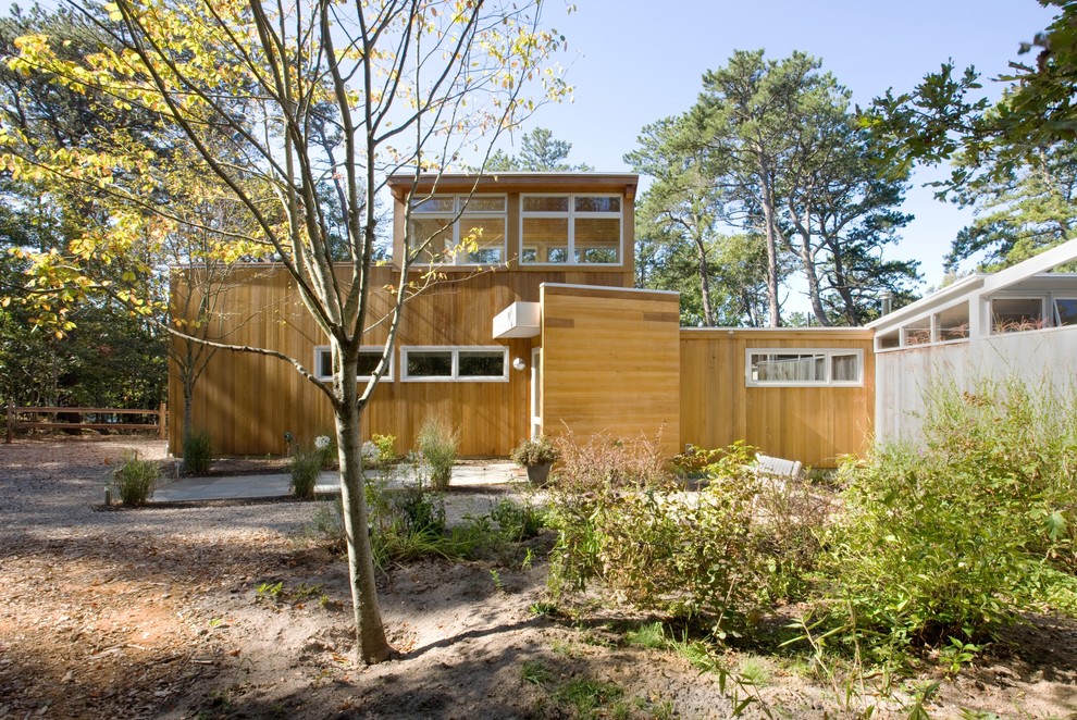 Inspiration for a midcentury exterior in Boston with wood siding.