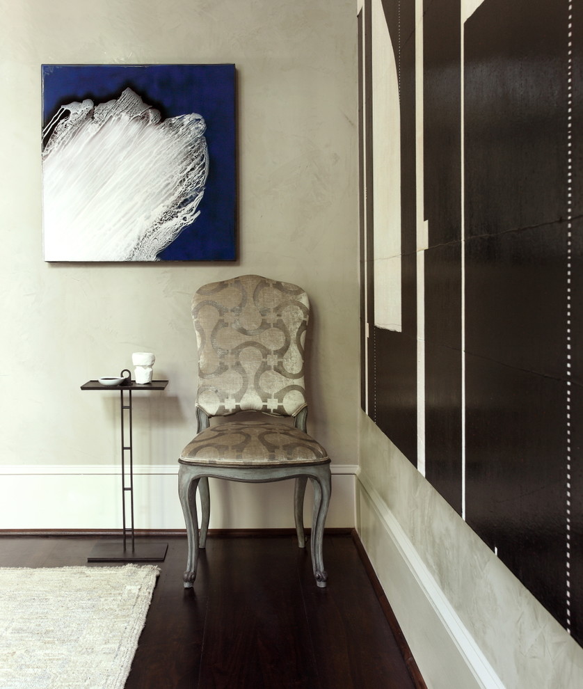 Transitional dark wood floor and brown floor living room photo in Atlanta with beige walls, a standard fireplace and a plaster fireplace