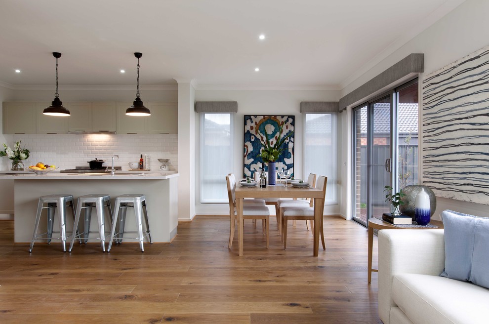 Design ideas for a contemporary open plan dining in Melbourne with white walls and light hardwood floors.