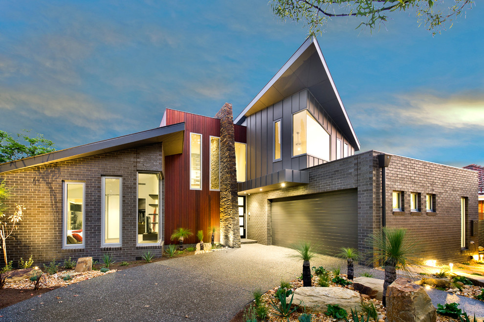 This is an example of a large contemporary two-storey brick multi-coloured exterior in Melbourne.