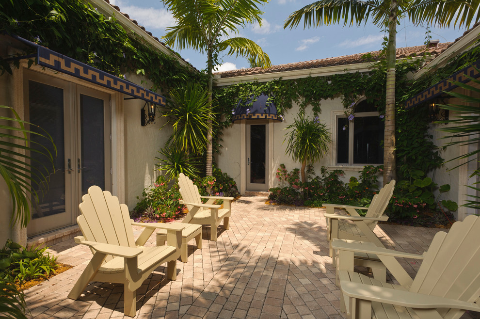 This is an example of a mediterranean courtyard patio in Miami.
