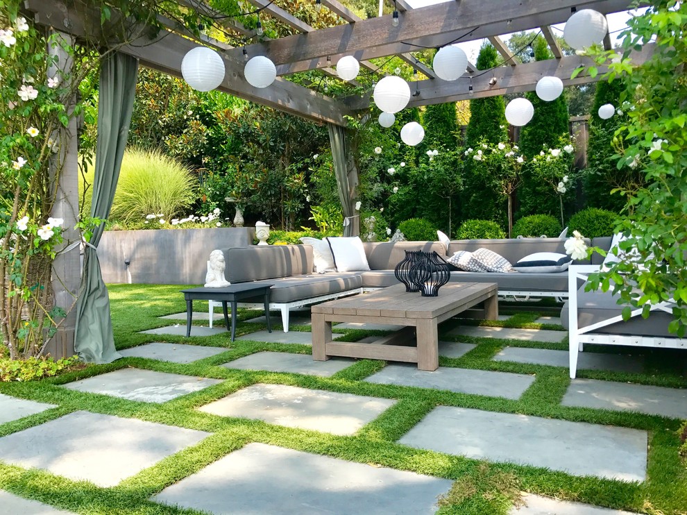 This is an example of a transitional backyard patio in San Francisco with a pergola.