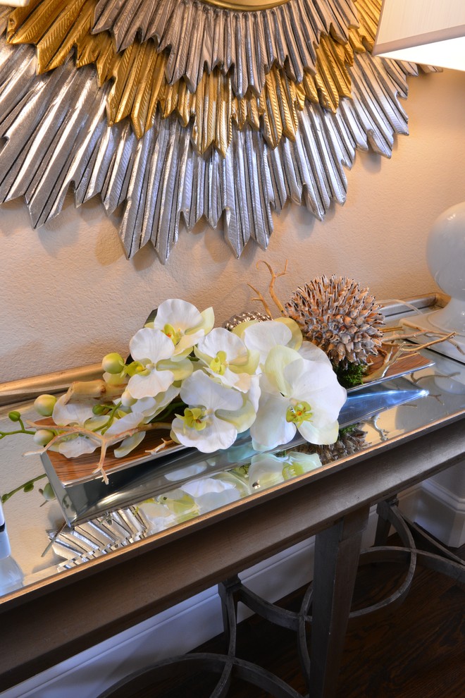 Example of a mid-sized transitional medium tone wood floor foyer design in Dallas with beige walls