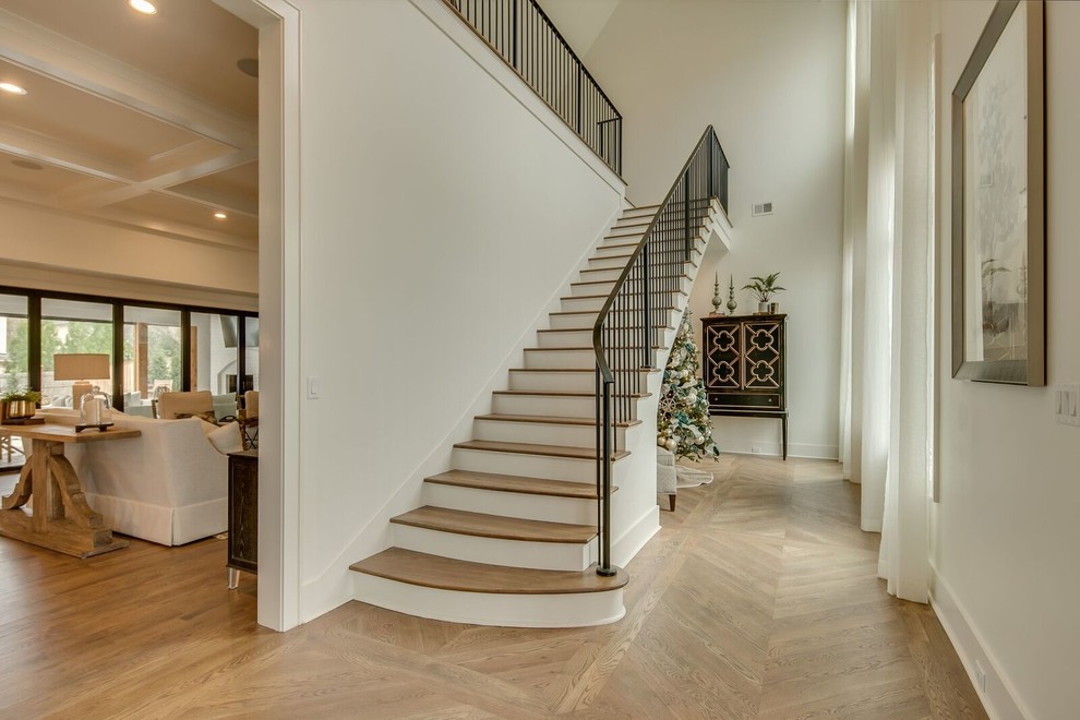 Inspiration for a large traditional wood l-shaped staircase in Other with painted wood risers and metal railing.