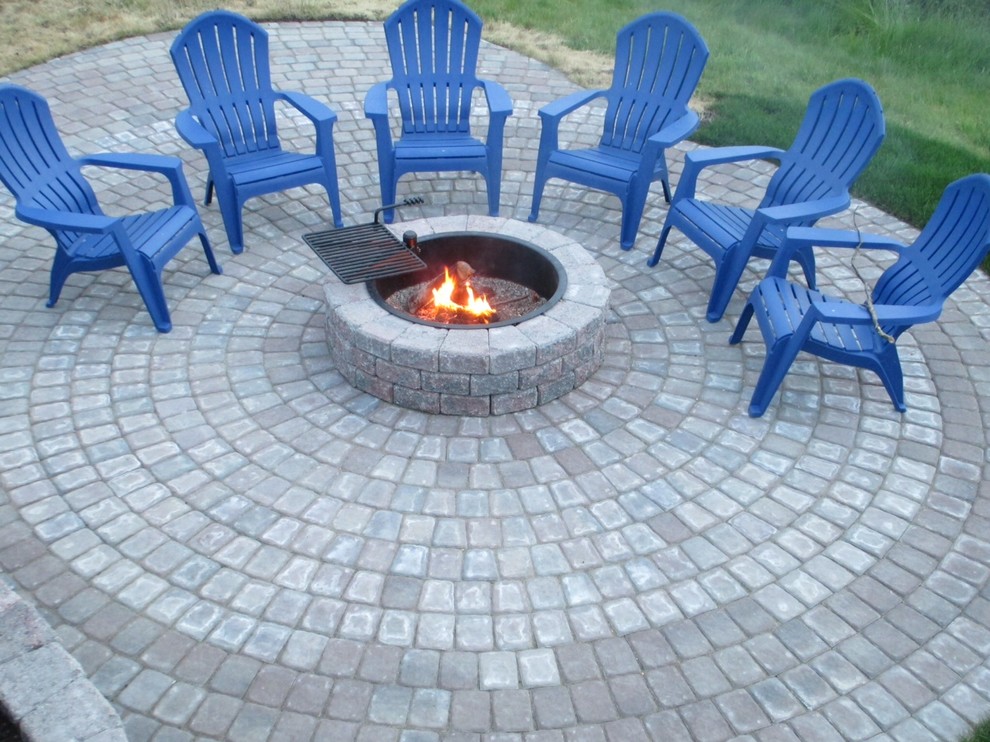 Inspiration for a large traditional backyard patio in Seattle with a fire feature, concrete pavers and no cover.