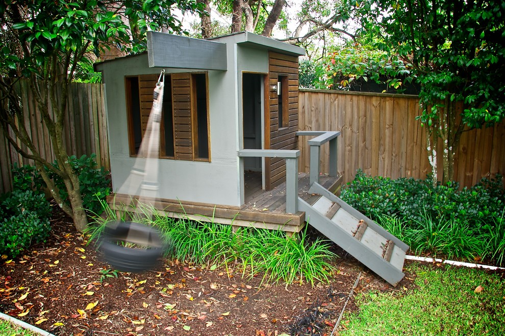 Photo of a small contemporary garden in Sydney with with outdoor playset.