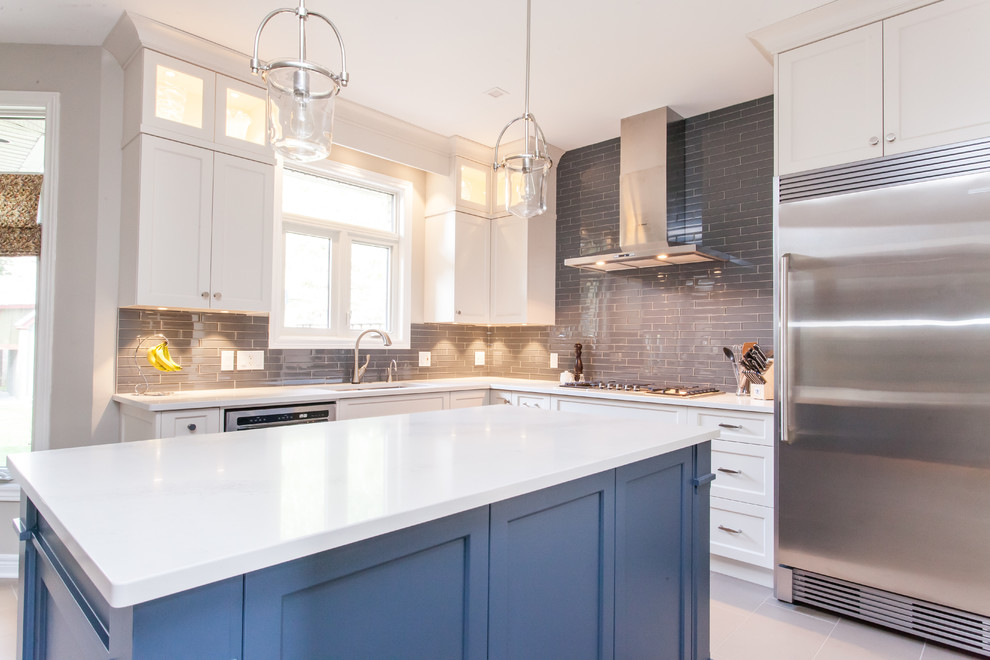 Inspiration for a large transitional u-shaped porcelain tile and gray floor eat-in kitchen remodel in Toronto with an undermount sink, recessed-panel cabinets, white cabinets, quartz countertops, gray backsplash, subway tile backsplash, stainless steel appliances, an island and white countertops