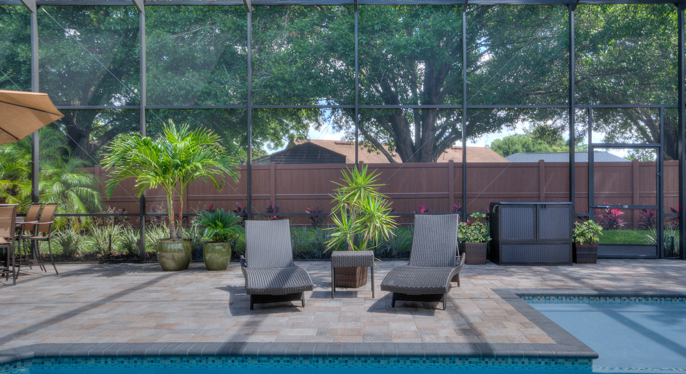 Hot tub - large transitional backyard stone and custom-shaped lap hot tub idea in Orlando