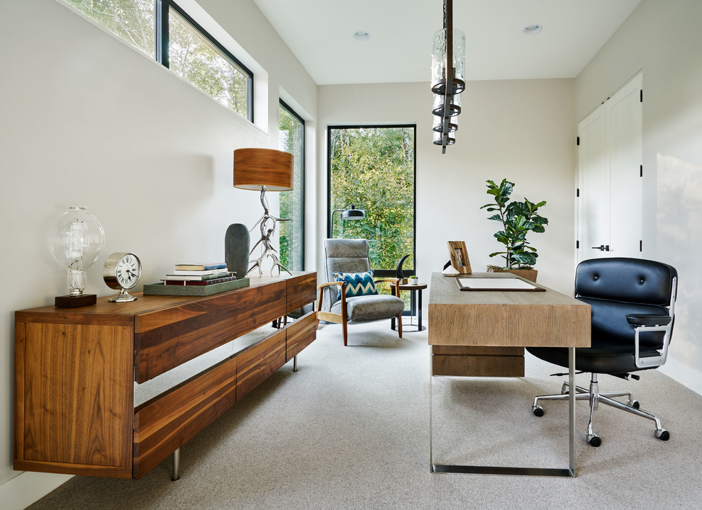 This is an example of a contemporary study room in Portland with grey walls, carpet, no fireplace, a freestanding desk and grey floor.