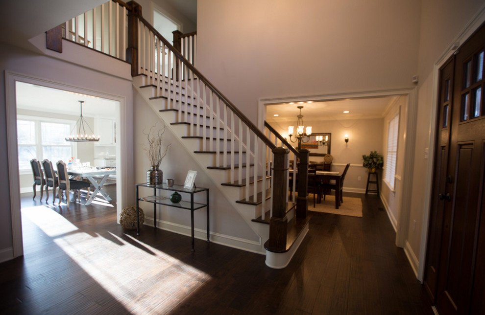 Single front door - mid-sized transitional dark wood floor and brown floor single front door idea in Philadelphia with a dark wood front door and beige walls